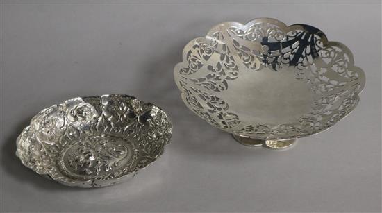 A 1920s pierced silver bonbon dish and a Victorian repousse silver dish by William Comyns, 6 oz.
